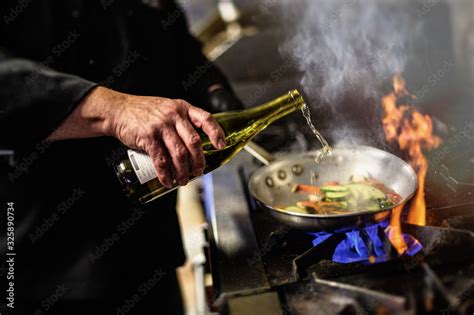 deglazing a pan with wine Stock-Foto | Adobe Stock