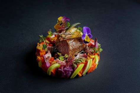 Gourmet Meat Dish with Colorful Vegetables and Edible Flowers Stock ...