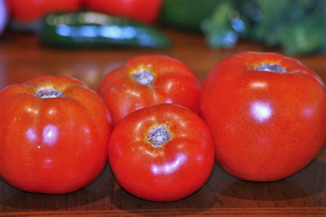Four Vine-ripe Tomatoes On Table Free Stock Photo - Public Domain Pictures
