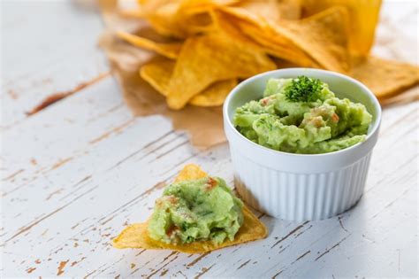 Premium Photo | Guacamole sauce and nachos