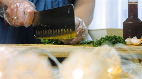 Macro filming of Worcestershire sauce. The chef pours the sauce into a ...