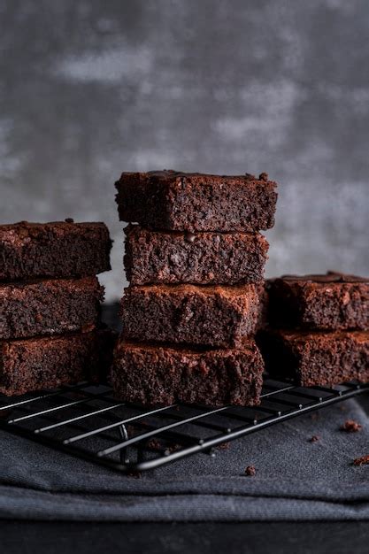 Premium Photo | Front view of brownies on cooling rack with cloth