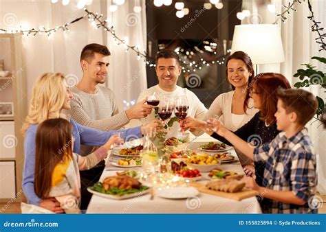 Happy Family Having Dinner Party at Home Stock Photo - Image of dinner ...