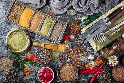 Premium Photo | Spices and seasonings on a wooden table